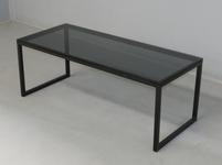 Coffee table with tinted glass top and metal legs